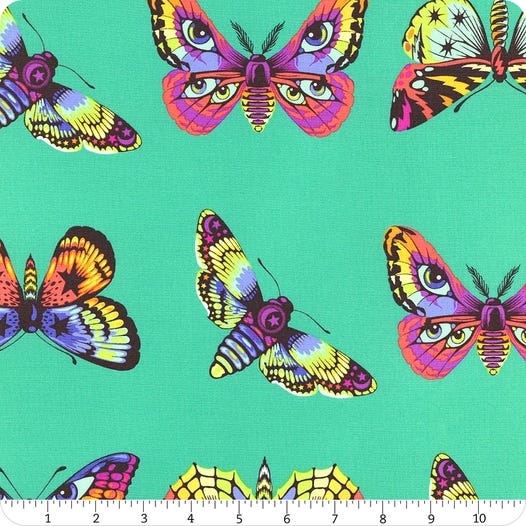 Butterflyt Hugs i farven lagoon fra kollektionen Daydreamer af Tula Pink